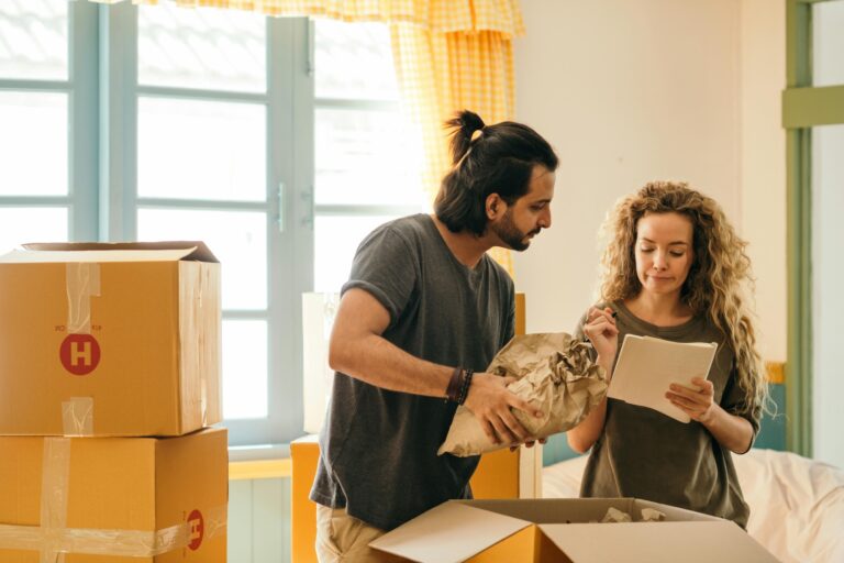 A couple is packing things in their old house in the concept of moving to Coulsdon.