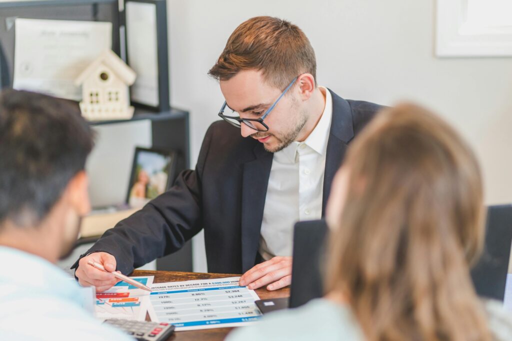 A real estate agent is explaining the housing options to a couple